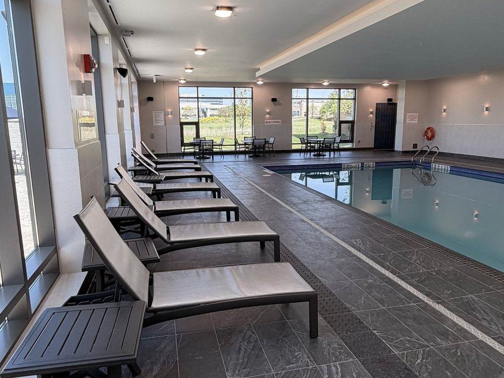 Loungers on the pool deck where parents watch lessons